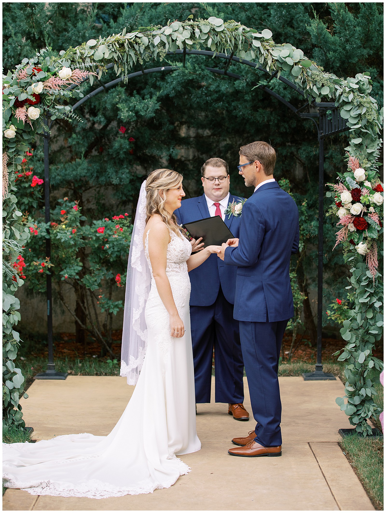 bride-and-groom-exchanging-rings-at-wedding-ceremony-tulsa-wedding-photographer-dresser-mansion-wedding
