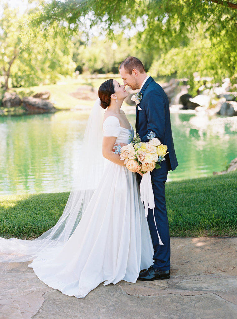 oklahoma city wedding photographer first look picture under willow tree at coles garden OKC